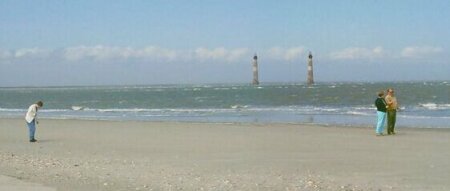 This photo is a fake. There's only one lighthouse at Folly Beach.